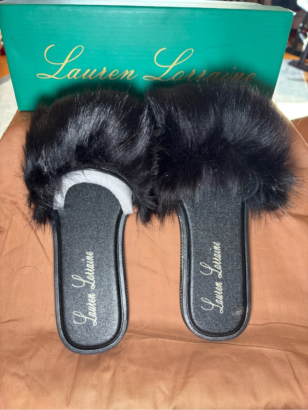 "Fluffy" Faux Fur Gel Slide Slippers by the brand Lauren Lorraine.